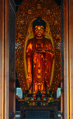 old Chinese Buddhist statue in Qita Temple (The Seven Pagodas Temple) in early summer at Yinzhou, Ningbo, China