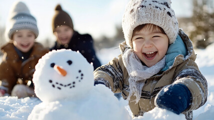 joyful child playing in snow with snowman and friends