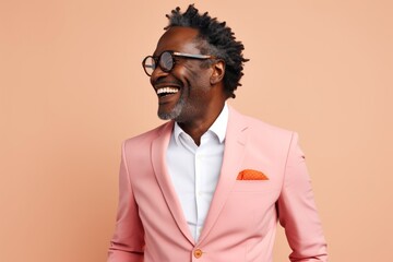 Fototapeta premium Portrait of a cheerful afro-american man in his 50s dressed in a stylish blazer isolated in plain white digital canvas