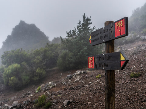 Signs for the Pico do Areeiro and Pico Ruivo hiking destinations in opposite directions on the island of Madeira, Portugal; Sao Roque do Faial, Madeira, Portugal