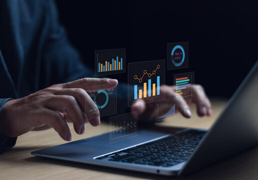 Businessman is analyzing data, working with computer using statistical graphs, managing work structure data on dashboard, evaluating and measuring the performance of business organization - Powered by Adobe