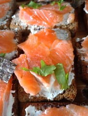Salmon and cheese sandwiches. Healthy snack with red fish.