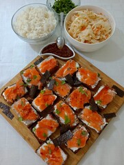 Rice with salad. Salmon and cheese sandwiches. 