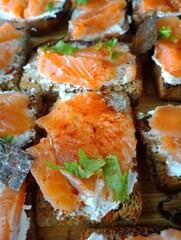 Sandwiches with salmon and cream cheese. Healthy snack with red fish.