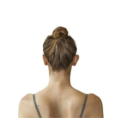 Rear view of a young woman with her hair in a bun.