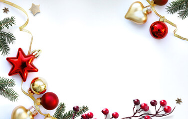 Christmas frame composition flatlay. Spruce branches and Christmas decorations on white background with space for text.