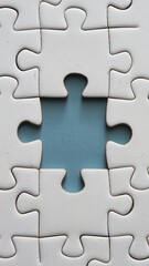 Close-up of jigsaw puzzle with one open missing piece