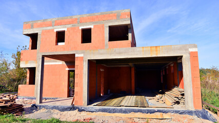 View of a single family house under construction. Luxury house under construction.