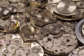 Old mechanical watches with gears and cogs. Watch or clock mechanisms