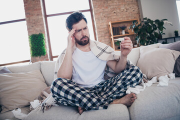 Photo of young sick ill man wearing pajama feeling unwell high temperature symptom indoors