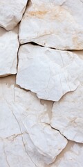 Fototapeta premium A white rock with a crack in it. The crack is long and deep. The rock is rough and jagged