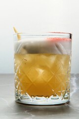 Yellow Cocktail with Foam and Lemon Zest