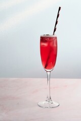 Red Cocktail with Straw and Fresh Strawberry