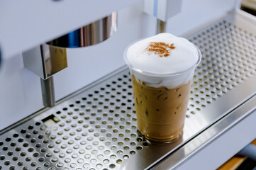 Coffee latte with milk foam.Coffee from a large coffee maker.