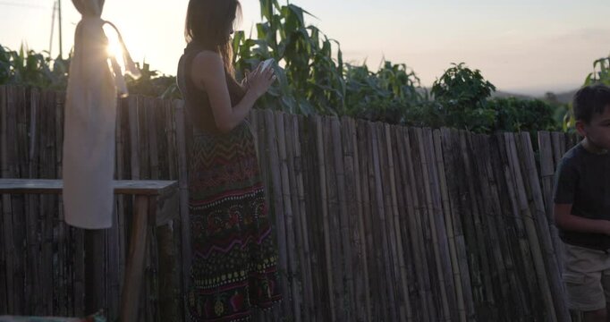 Mother and son waiting at resturant near South American Coffee feild