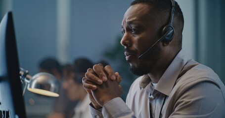 Call center office of emotional support line: Portrait of African American hotline specialist in...
