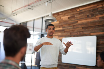 Speaker, man and presentation with audience in office for workshop training, communication and...