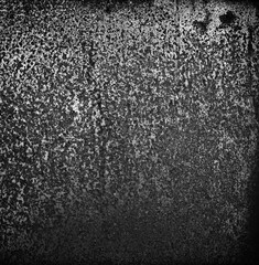 Monochrome backdrop of rusty surface dark gray hues. Black and white grunge rust metal texture. Close-up abstract background of aged old iron, scratch pattern, worn, distress area, corrosion details