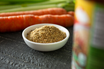 A view of a condiment cup of beef bouillon.