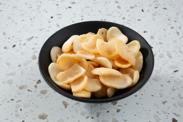 A view of a bowl of shrimp chips.