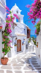 Fototapeta premium Charming whitewashed village with bell tower and vibrant bougainvillea in Spain