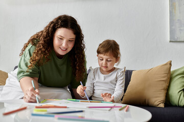 A plus size woman and her daughter share a joyful afternoon, creating colorful artwork together.