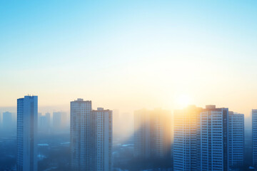 Fototapeta premium Modern skyscrapers silhouetted against soft, hazy sunrise, casting a tranquil atmosphere over the urban landscape.
