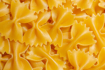 Uncooked Farfalle Pasta: A Culinary Canvas of Bow-Tie Macaroni, Creating a Lively and Textured...