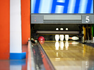 close-up of a bowling ball and pins. 