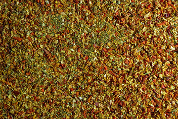 Vibrant and Colored Vegetable Seasoning Mix: A Culinary Canvas of Aromatic Seasoning - Textured Background for Gourmet Cooking. The Harmonious Combination of Fresh Herbs and Spices - Top View