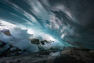 Ice cave in the glacier of Langgletscher at Lötschental in Wallis, Switzerland