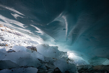 Ice cave in the glacier of Langgletscher at Lötschental in Wallis, Switzerland