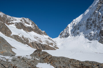 View of the Lötschental valley and glacier in autumn with snow covered peaks in Valais, Switzerland