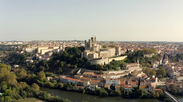 The old bridge and the Saint-Nazaire cathedral on the Orb in B&eacute;ziers, Occitanie, France