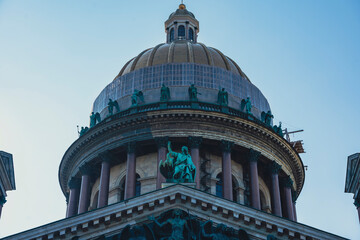 Dome of St. Isaacs Cathedral with sculptures and columns