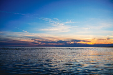 Tranquil sunset over calm ocean waves