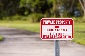 PRIVATE PROPERTY, NO PUBLIC ACCESS, VIOLATORS WILL BE PROSECUTED sign screwed to a metal post, on path, room for copy