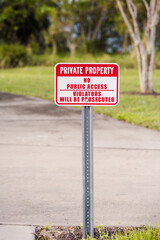  PRIVATE PROPERTY, NO PUBLIC ACCESS, VIOLATORS WILL BE PROSECUTED sign screwed to a metal post, verticle