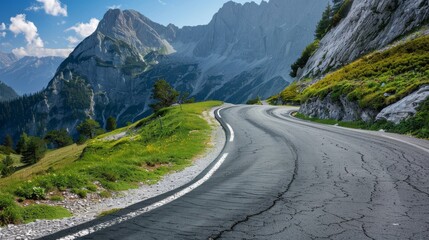 Naklejka premium Curved asphalt road in Austria with breathtaking mountain views