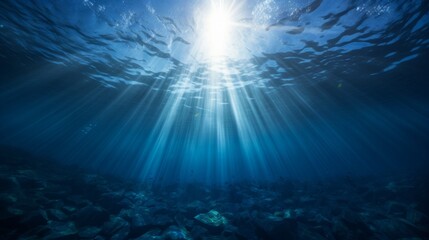 Deep blue ocean from below, sunlight streaks through water