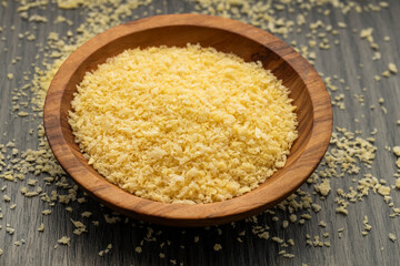 Yellow japanese panko crumbs in the wooden bowl.