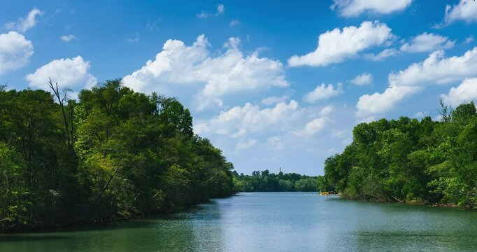 Timelapse of the Catawba River near Charlotte, North Carolina, with a dock of boats and clouds in the distance.