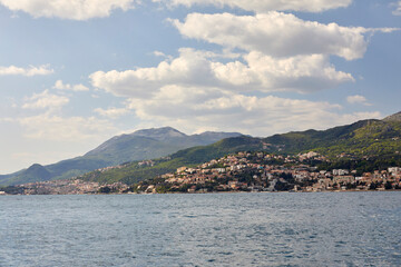 Landscape with blue sea and green mountains