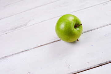 fresh green apple on the table