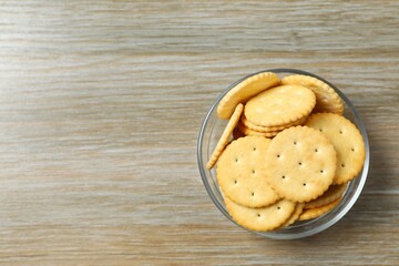 Delicious crispy crackers cookies on wooden background