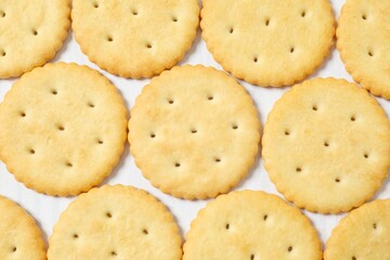 Delicious crispy crackers cookies on wooden background