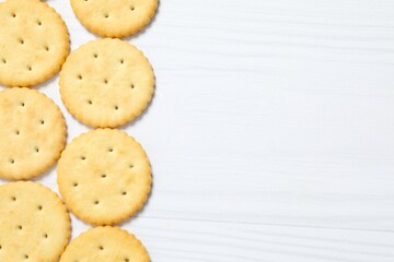 Delicious crispy crackers cookies on wooden background