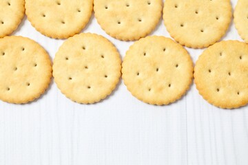 Delicious crispy crackers cookies on wooden background