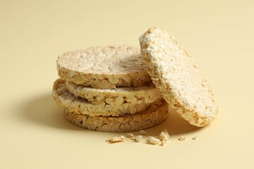 Round rice cakes on color background 