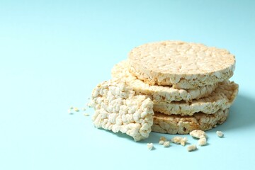 Round rice cakes on color background 